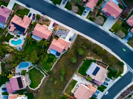 aerial view of neighborhood in california with solar panels