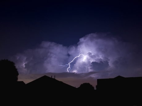 lightning storm over homes